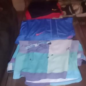 Two pairs of Nike shorts and One bathing suits Hurley Brand